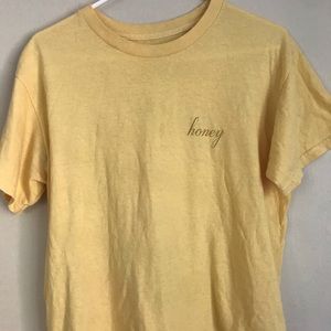 Brandy Melville yellow graphic honey tee